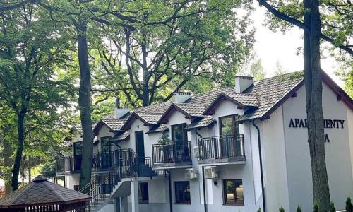 Domki , pokoje , apartenty . Wypocznij nad jeziorem z Apartamentami Orla